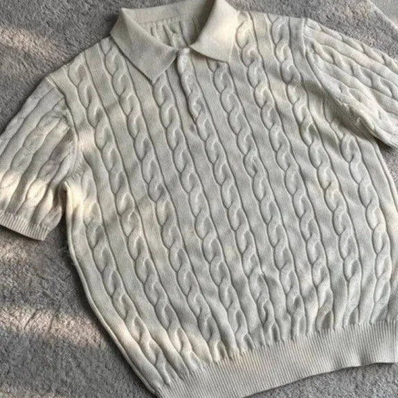 Short sleeve twisted knit summer T-shirt in light gray on a hanger