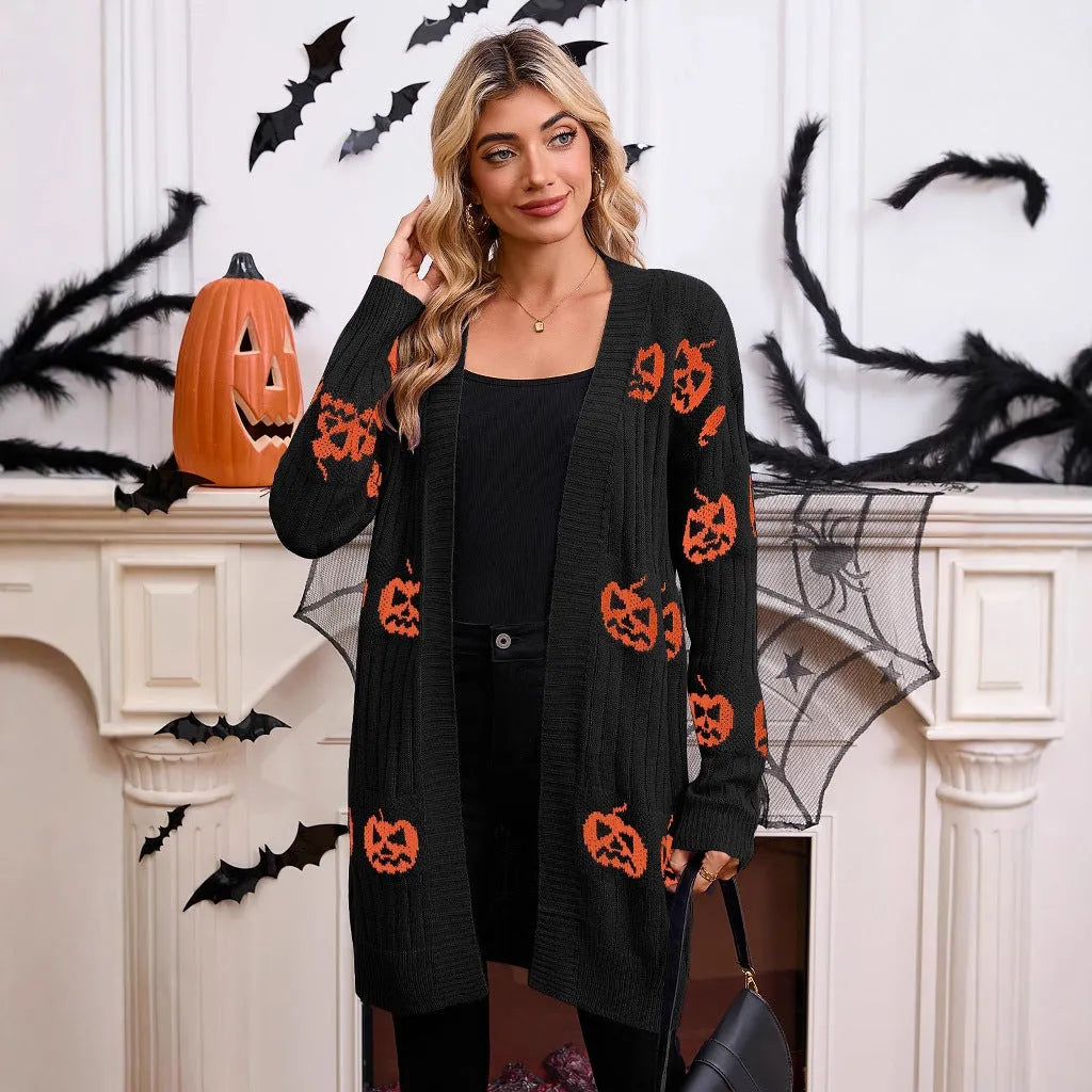 Women's black Halloween cardigan with orange Jacquard knitted pumpkin head pattern, shown as an open medium-length knit.