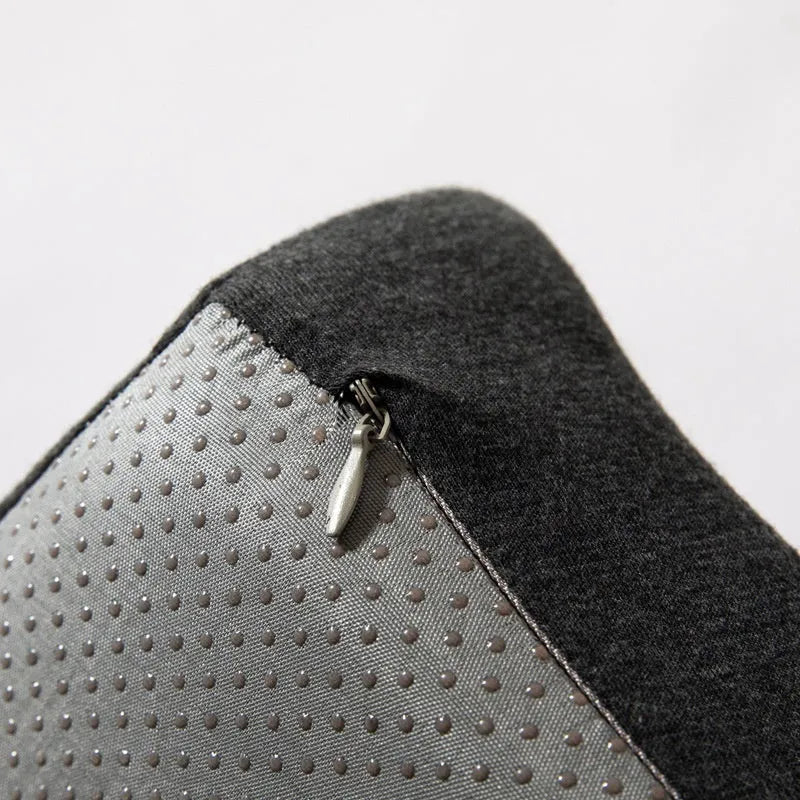 A black memory foam office chair cushion measuring 36 by 40 centimetres on a desk chair.