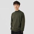 Man wearing a loose-fit army green long sleeve pullover sweater for casual autumn wear.