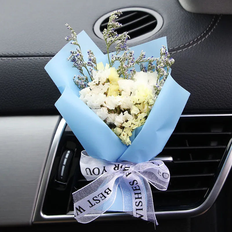Dried flower car air freshener with natural aroma slices mounted on vehicle air conditioning vent