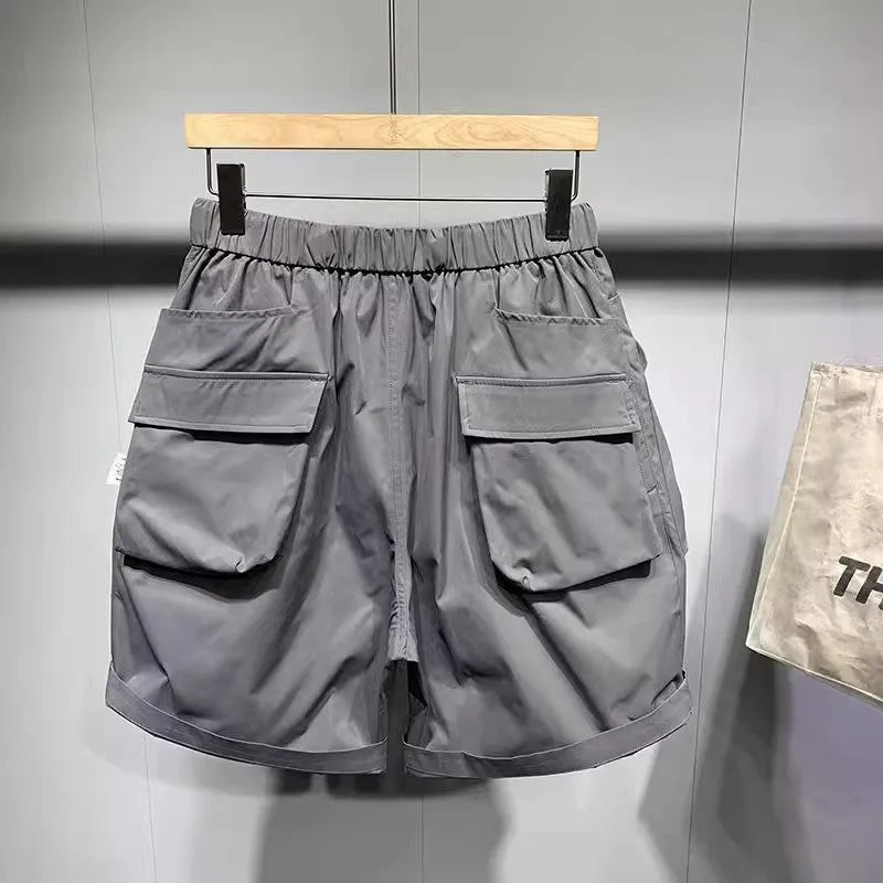 Men's large size work shorts in black with elastic waist and pockets