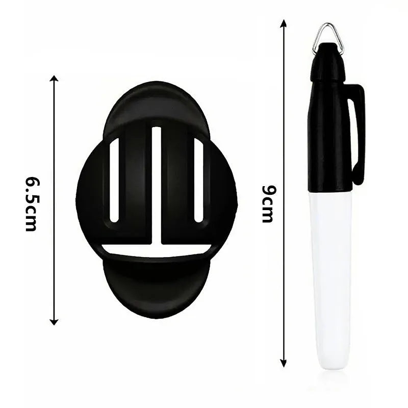 Plastic golf scriber putter alignment tool set with scribers and drawing pens on a green.