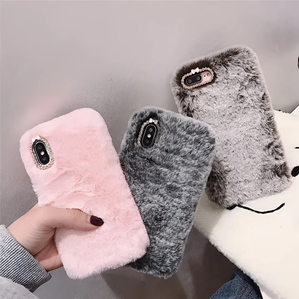 Silicone iPhone case with grey faux rabbit hair plush back and rhinestone decoration.