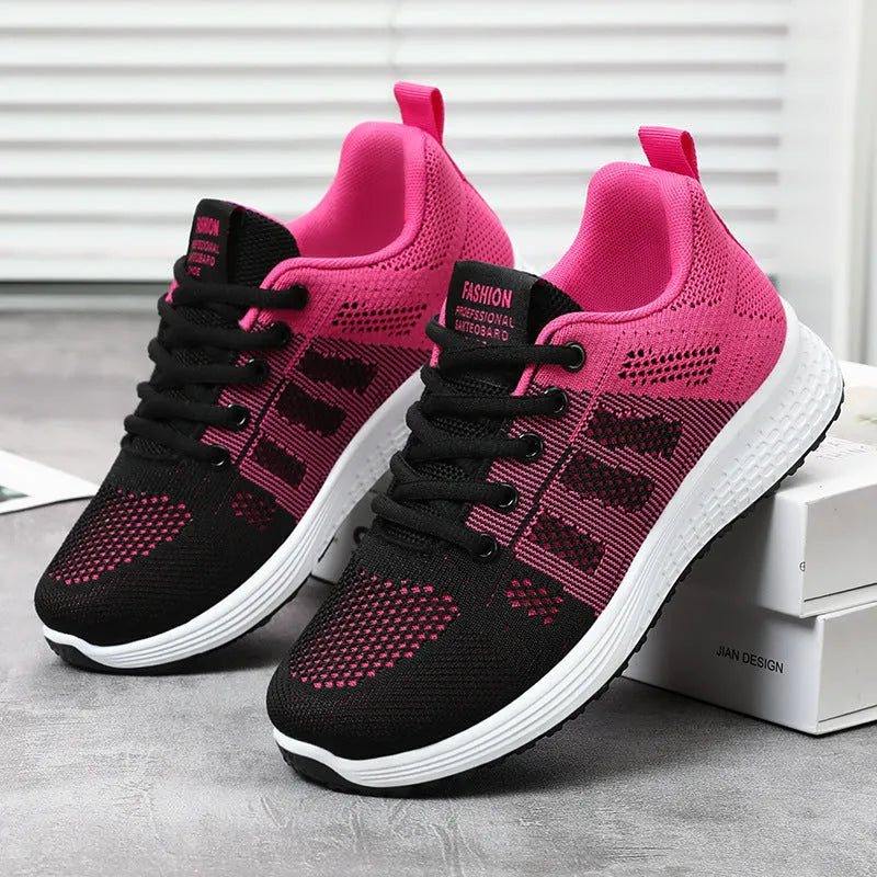 Women's flyknit running shoes in black with lace-up front and round toe design