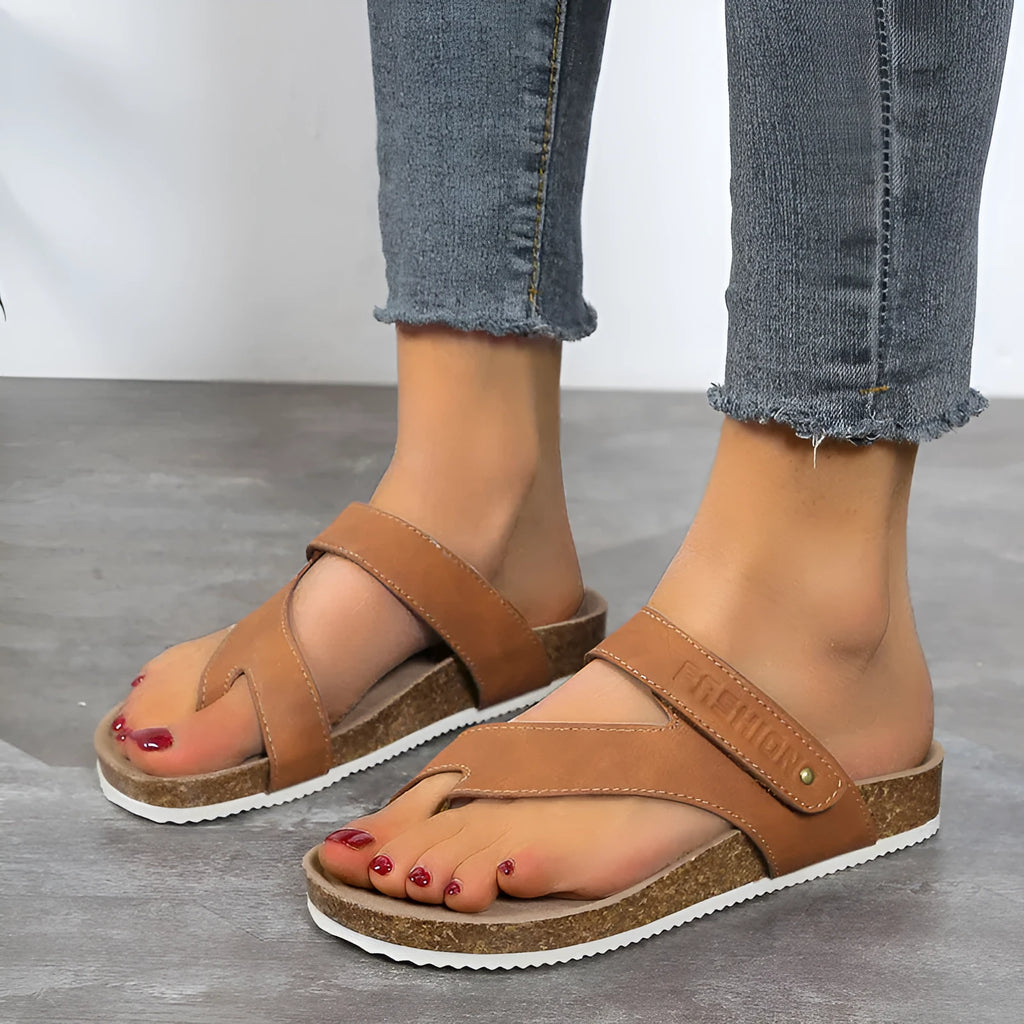 Flat toe ring thick-soled flip-flops in a solid colour with artificial PU upper and foam sole.