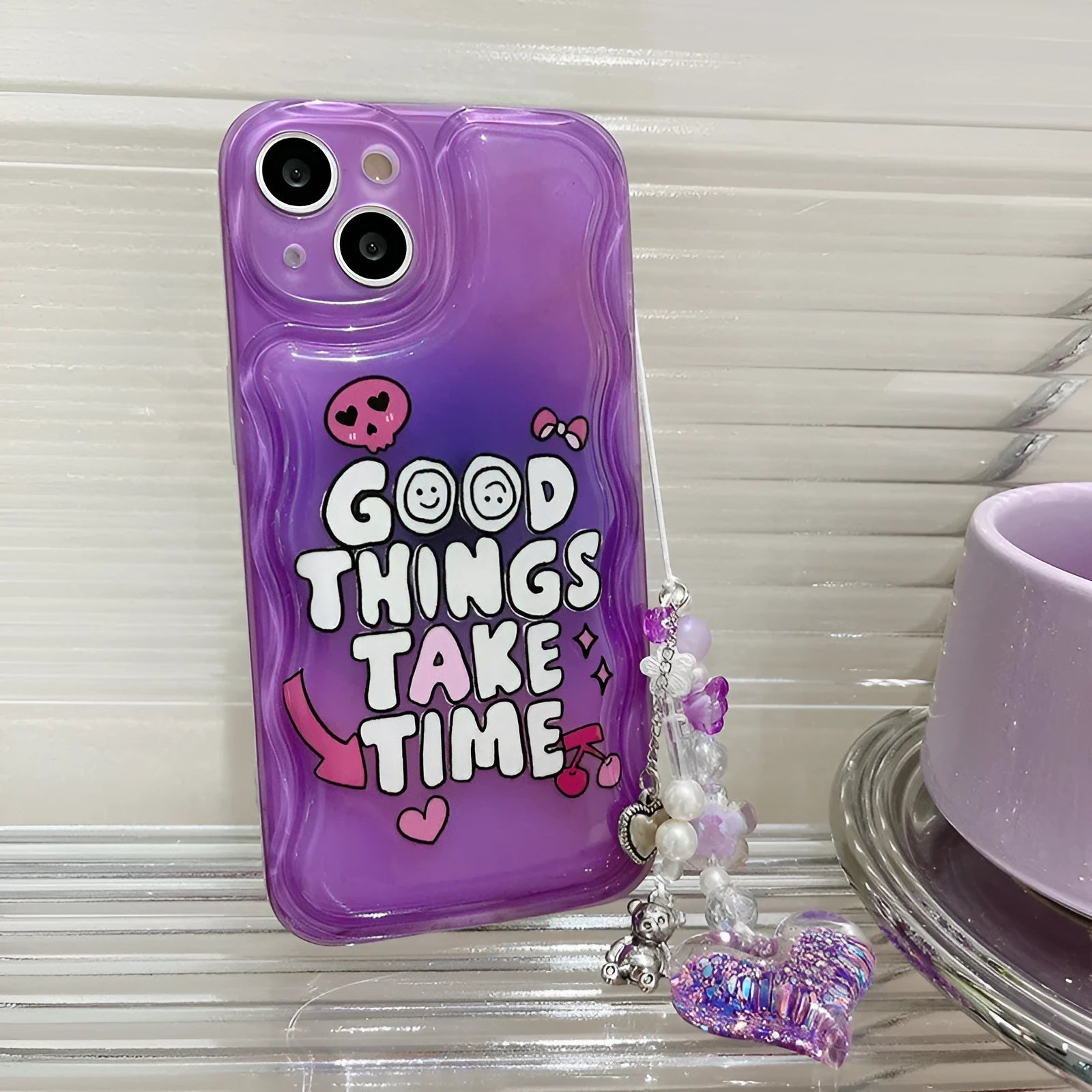 Purple mobile phone case with English graffiti text and love pendant design, featuring attached lanyard