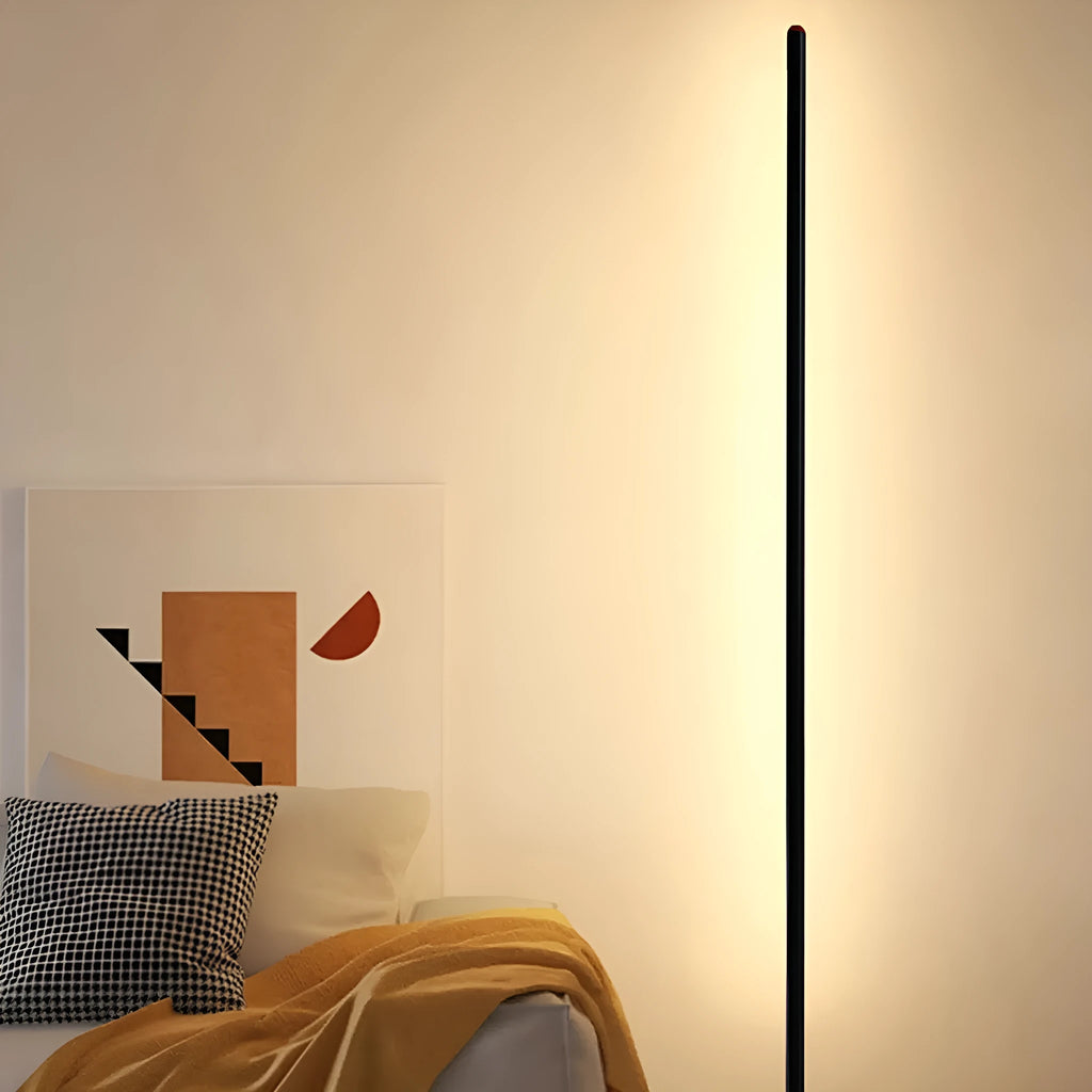 Tall, slim aluminium alloy vertical LED floor lamp standing beside a modern sofa.