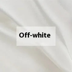 Double-sided silk duvet cover in plain weave, shown in one of six solid colours, laid flat on a bed.