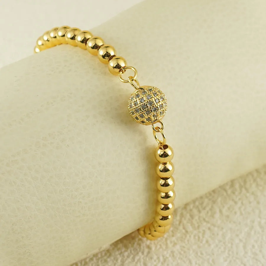 Heart-shaped copper bracelet with round zircon stones in an Arabic style.