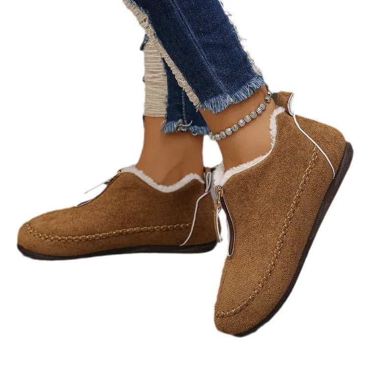 Women's suede retro low top boots in black showing low-top profile and rubber sole
