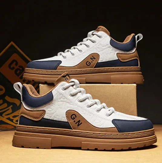 Black and white platform casual sneakers with thick rubber soles and colour-panelled pattern detailing