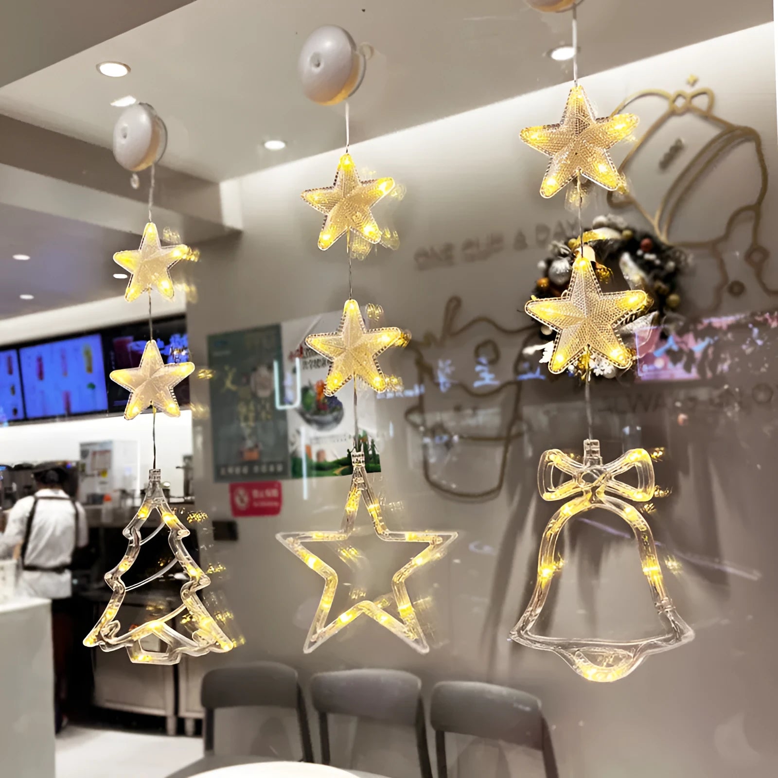 Christmas LED window decorations with suction cups showing star, tree, and deer pendant designs