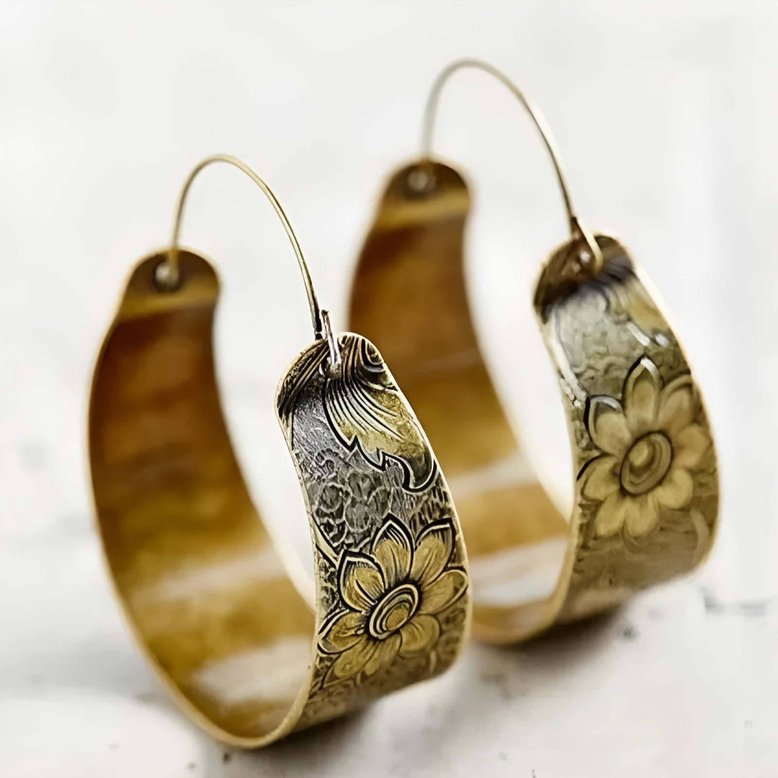 Gold geometric hollow pattern earrings with Maillard styling and petal design elements