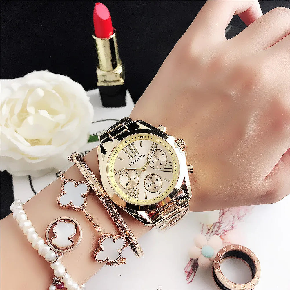 Women's silver rose gold quartz watch with diamond crystal mesh strap and analogue display.