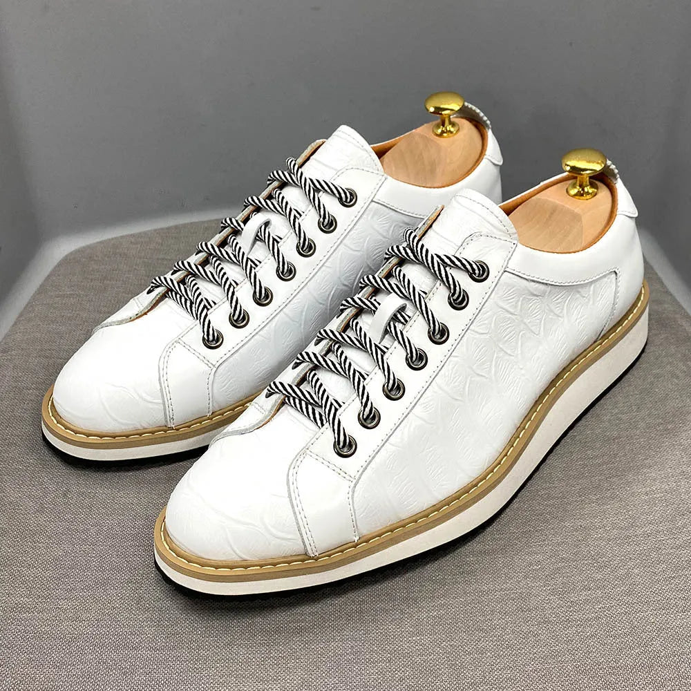 Men's black embossed pattern low-top lace-up trainers on a white background