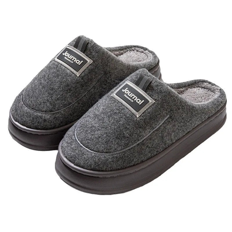 Men's grey suede slippers with thickened bottom and EVA sole showing extended sizing label