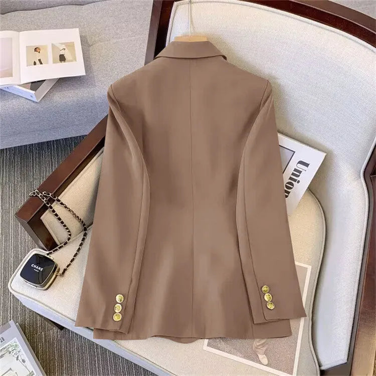 Women's loose-fit polyester blouse in multiple colours on a hanger.