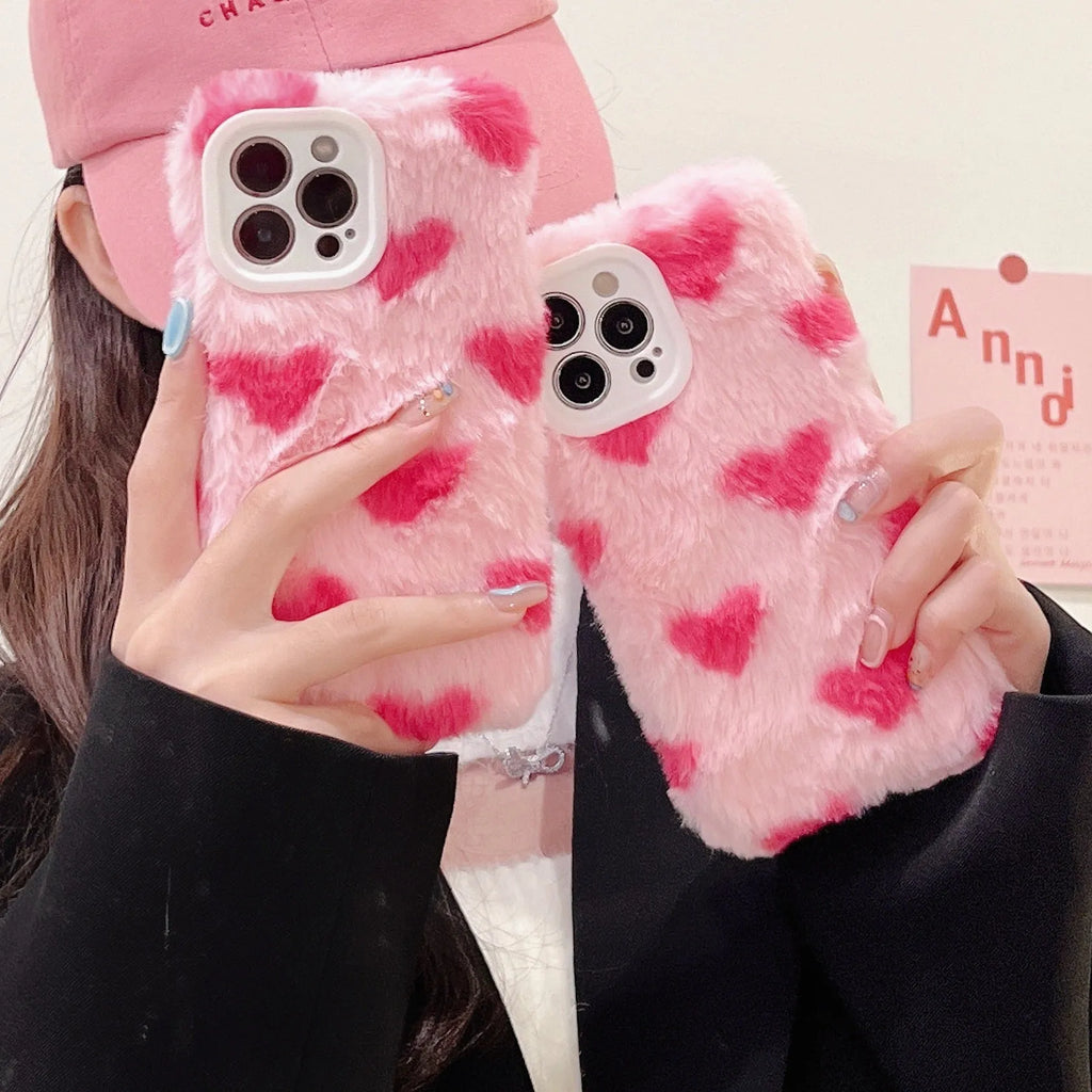 Pink silicone iPhone case featuring a Love Plush cartoon design on the back.
