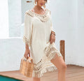 Apricot coloured crocheted patchwork dress with half sleeves and a mid-length hem.