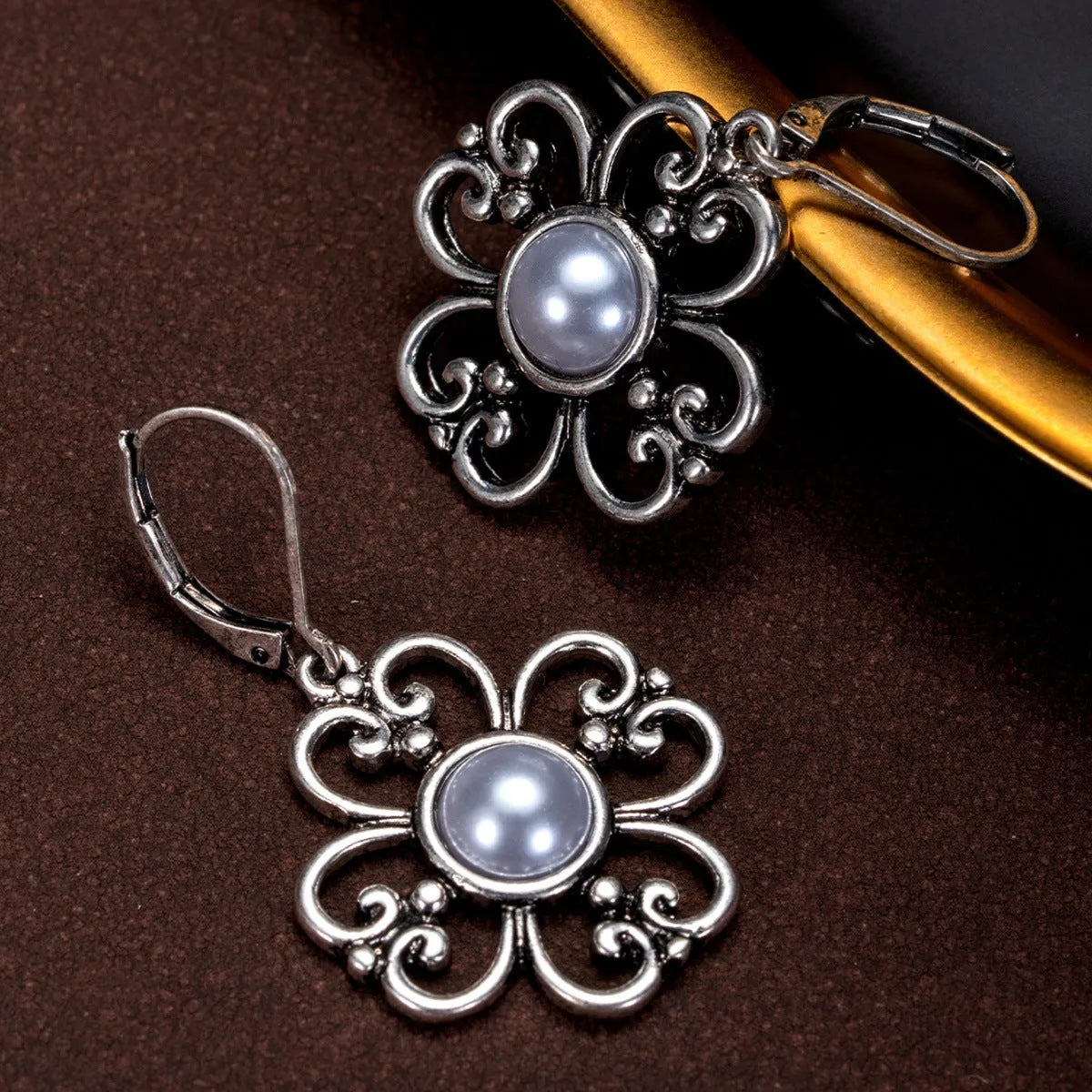 Women's gold-plated retro earrings with inlaid pearl in burnt silver colour