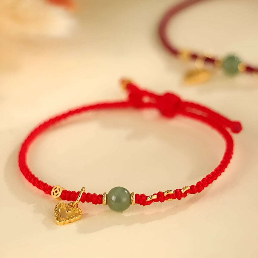 Women's handmade 925 silver and Hetian jade bracelet with adjustable woven cord strap