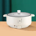 White electric hot pot with non-stick coating and stainless steel construction showing cooking functions