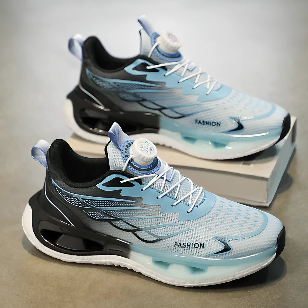 Low top youth sneaker with rotating button fastener in light blue, black, or white and blue colourways.