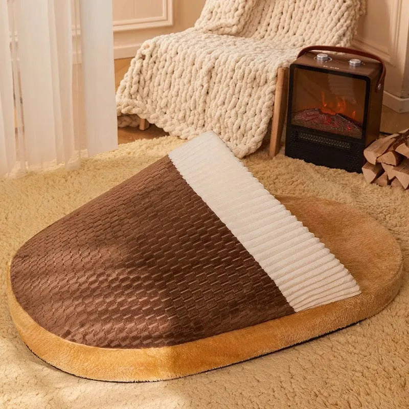 Blue round dog nest bed with removable cover for small medium dogs on a wooden floor