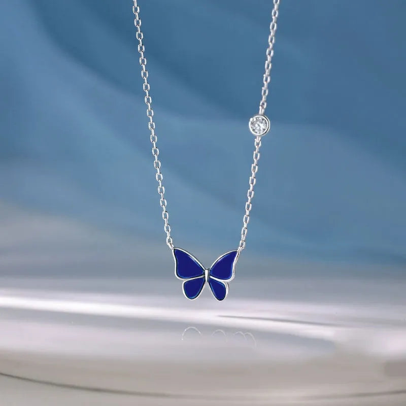 S925 silver butterfly necklace with white silver colour-change pendant on display
