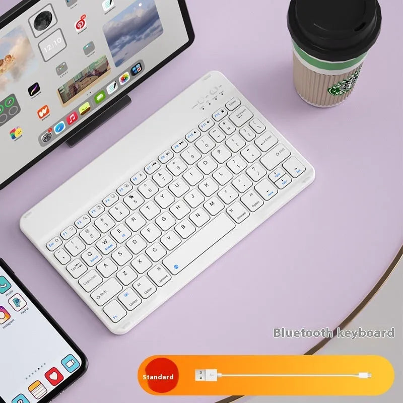 Bluetooth keyboard and rechargeable mouse set for tablet in elegant white on a desk