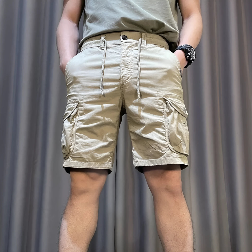 Loose straight-leg casual overalls trousers with multiple pockets in khaki colour.