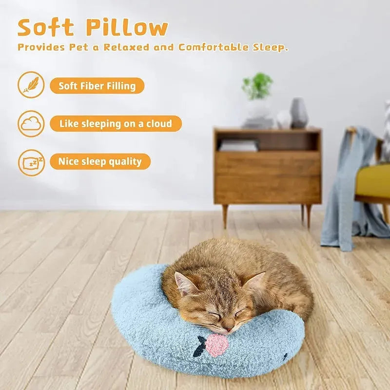 Small U-shaped plush pillow for cats and small dogs in blue, showing quilted faux fur texture.