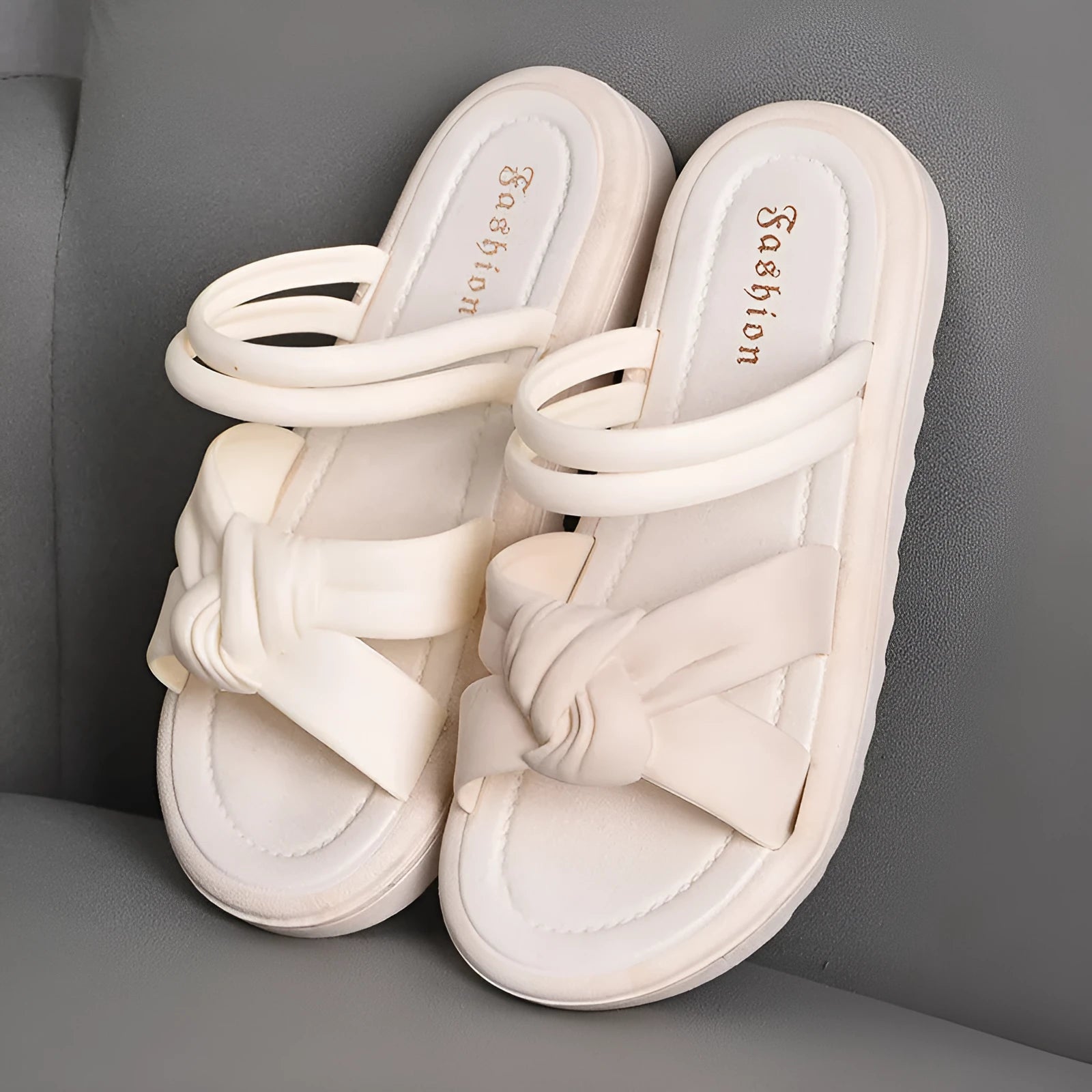 Women's black and white PVC sandals with a soft back, two-way strap design, and a non-slip sole.