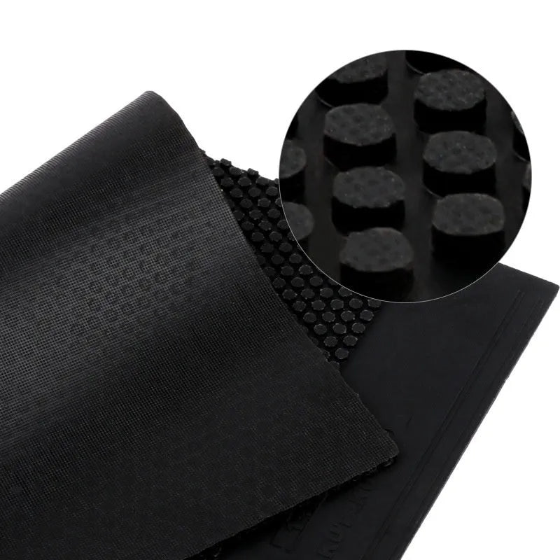 A single sheet of black table tennis rubber with a small pimple texture.