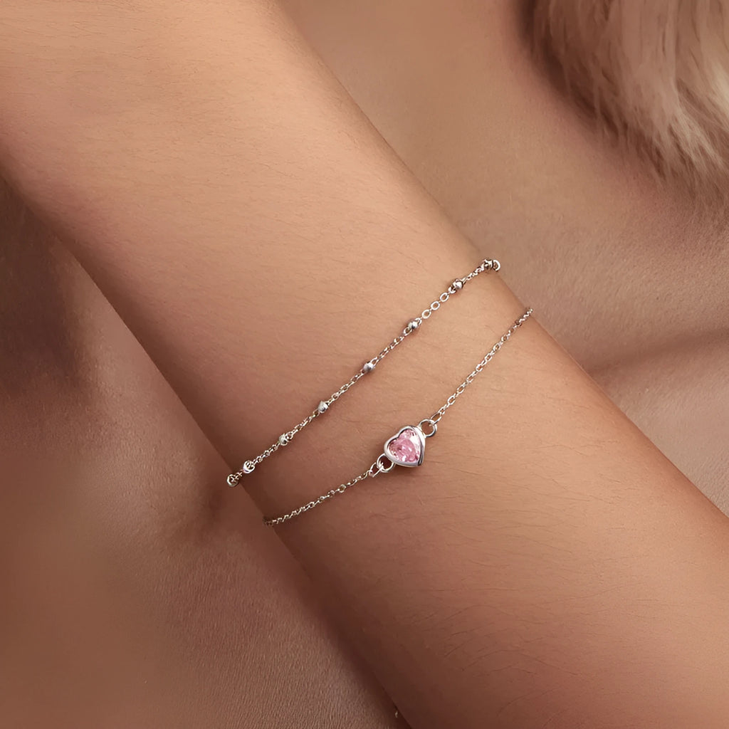 Women's sweet style 925 silver bracelet with small heart-shaped pendant on an adjustable chain.