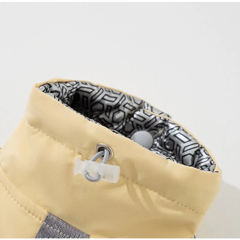 Xidao Di two-legged dog windbreaker coat in sunny yellow-blue colour on a small dog, with adjustable drawstring and D-ring.