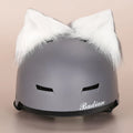 Soft plush cartoon character hat topper decoration for a ski helmet.
