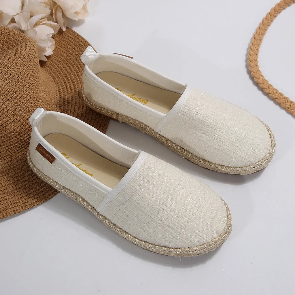 Casual fisherman shoes with canvas upper and rope sole in black, white, or beige colours