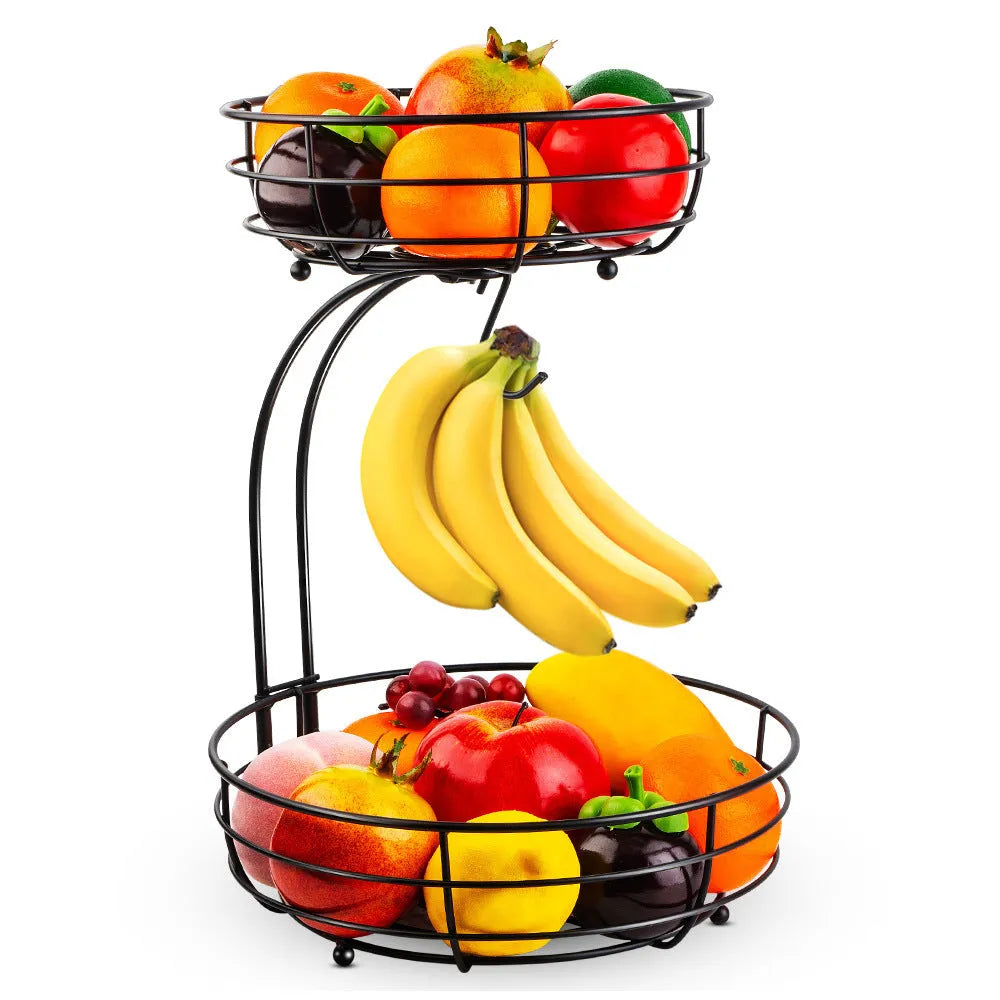 Double-layer black and gold wrought iron fruit basket for kitchen or restaurant storage.