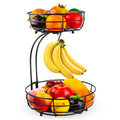 Double-layer black and gold wrought iron fruit basket for kitchen or restaurant storage.