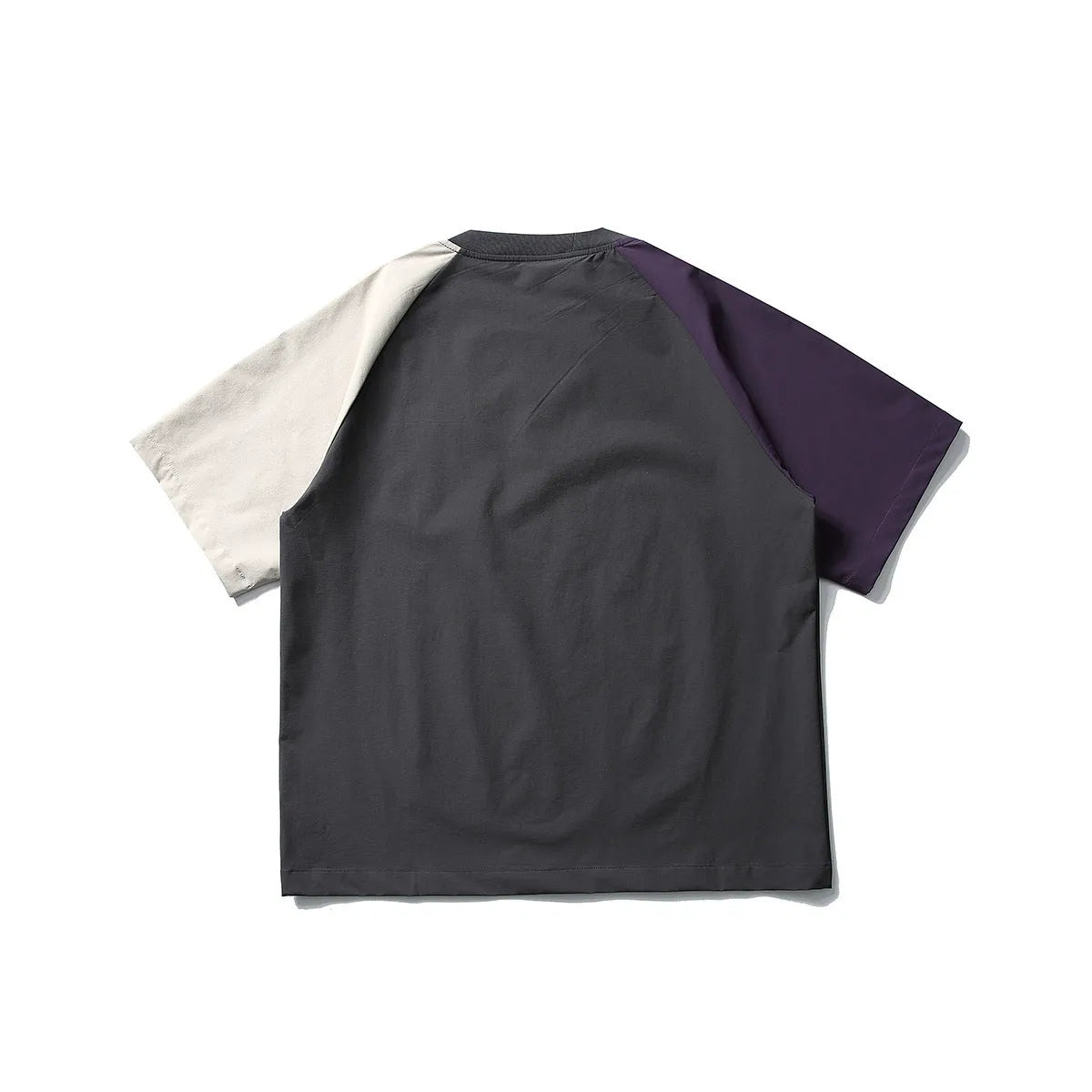 Dark grey loose fit T-shirt with contrast colour raglan sleeves on a hanger