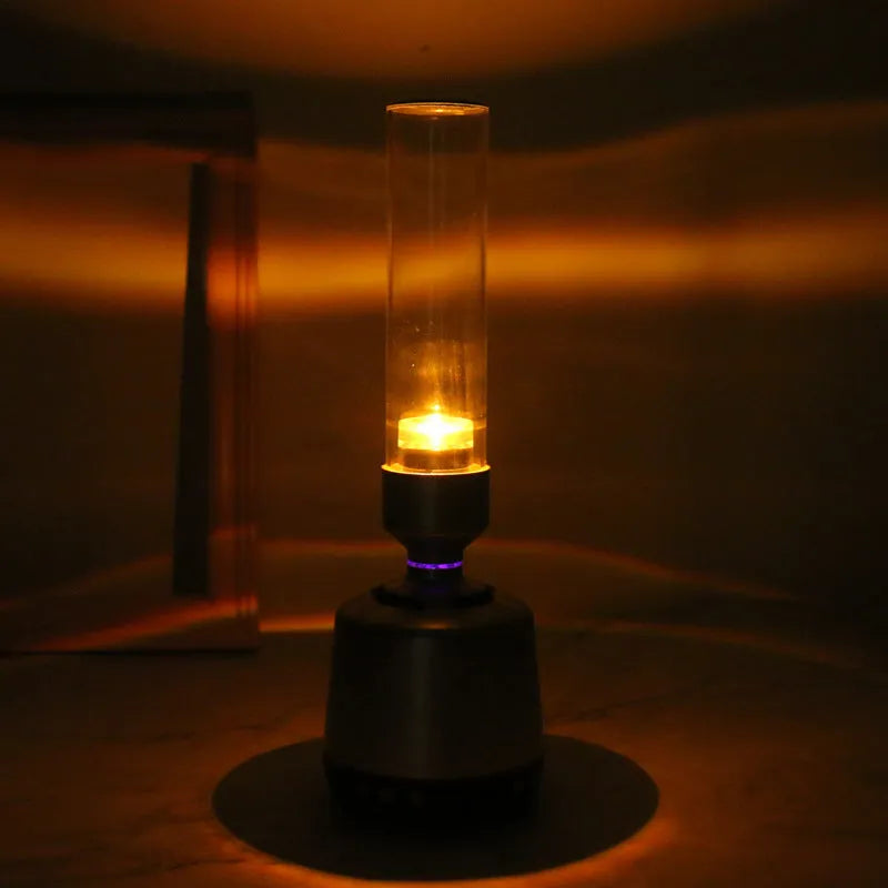 White Silver Candlelight Bluetooth speaker and night light with modern cylindrical design.