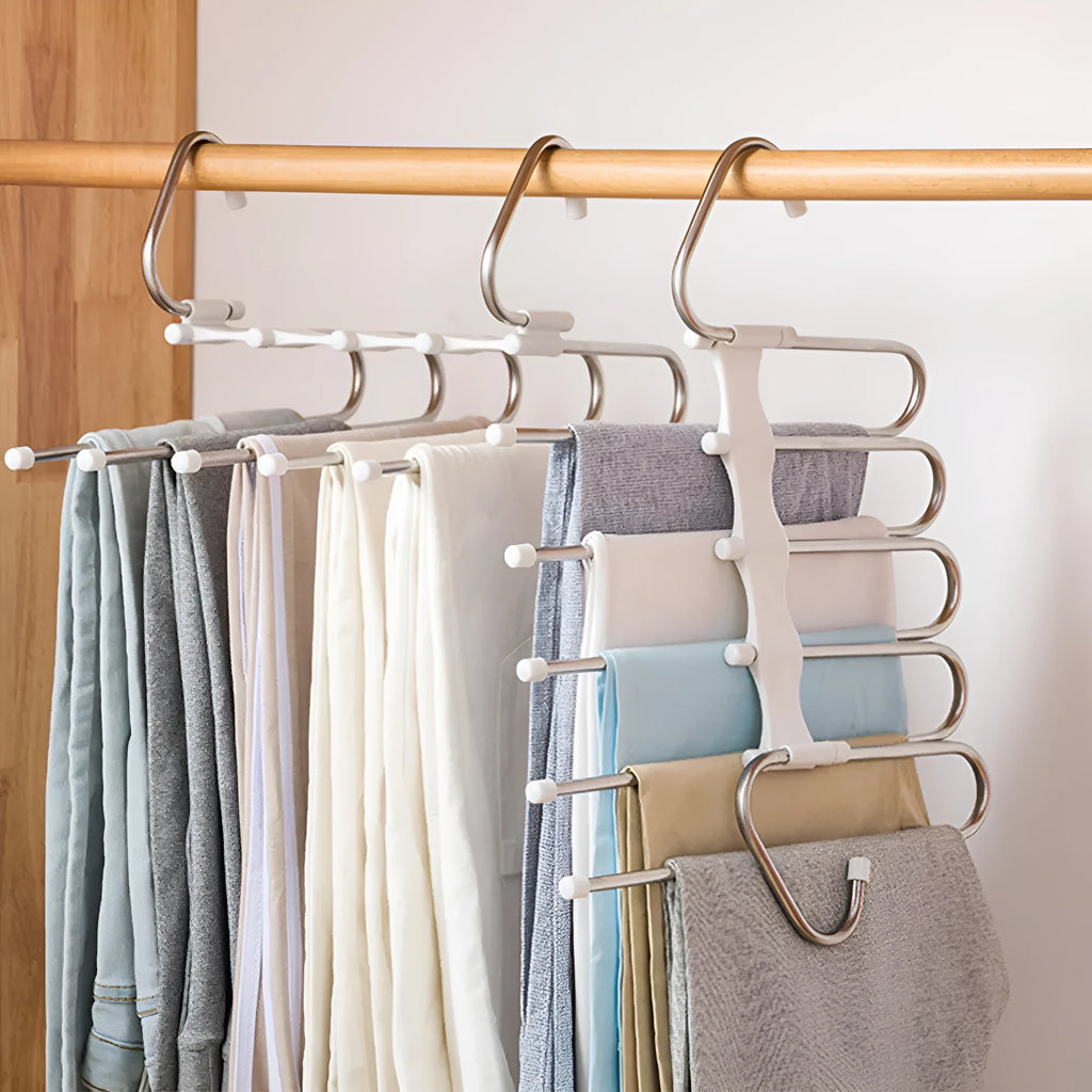 Black stainless steel magic wardrobe hanger with five booms for trousers.