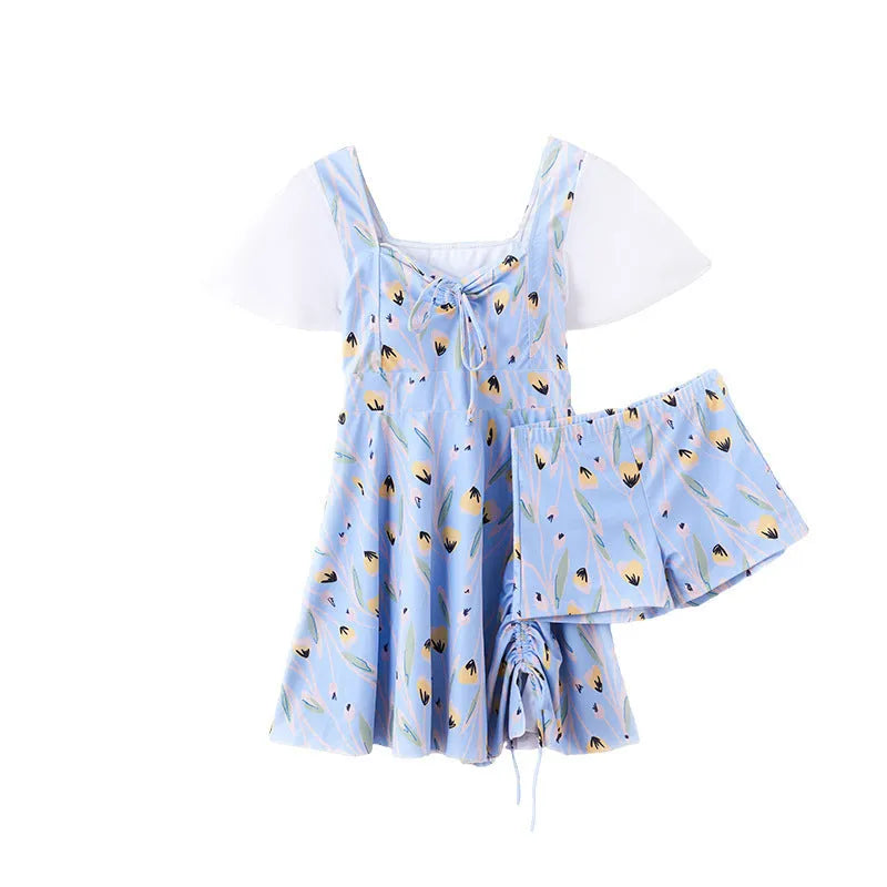 Women's sea salt blue floral one-piece polyester swimsuit on a hanger.