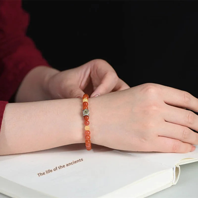 Natural Nanhong agate zodiac bracelet with beeswax bead showing constellation symbols for Chinese astrology