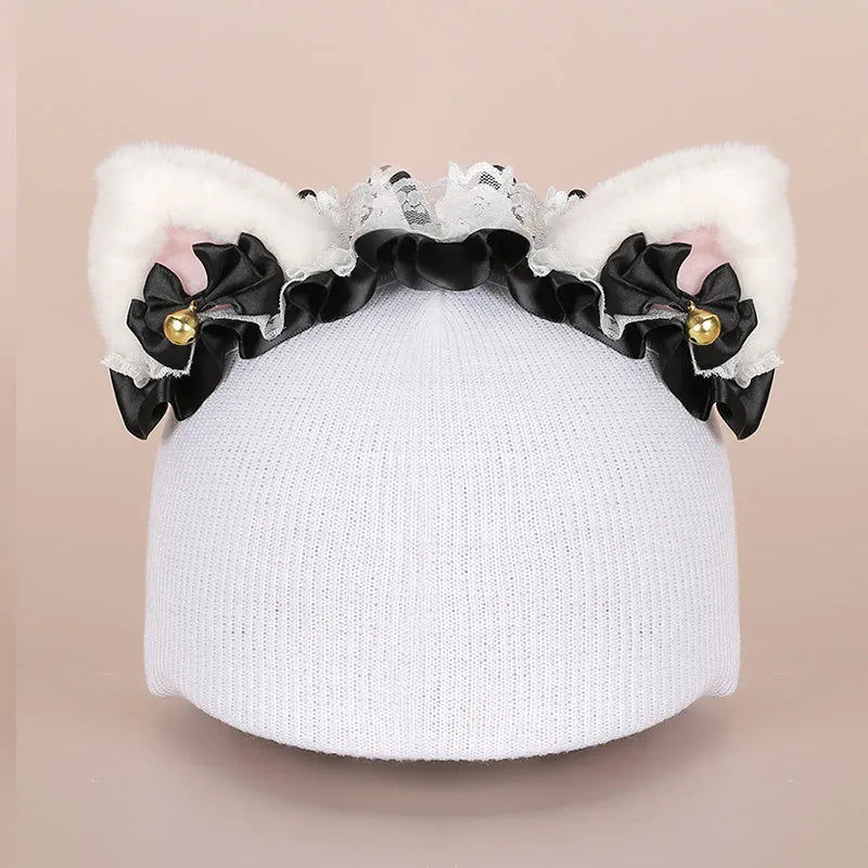 Soft plush cartoon character hat topper decoration for a ski helmet.