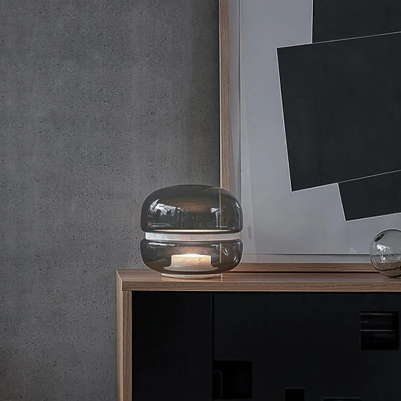 Nordic modern creative table lamp with warm light on a desk
