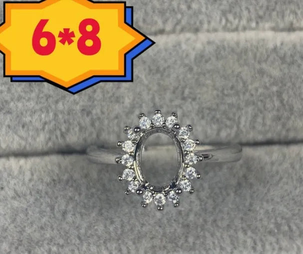 Oval denier ring with 6x8 mm stone and five-pointed star accent on open mouth copper band