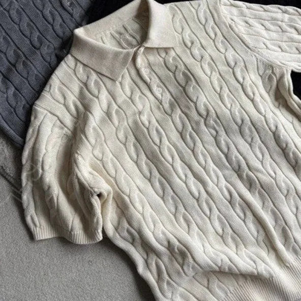 Short sleeve twisted knit summer T-shirt in light gray on a hanger
